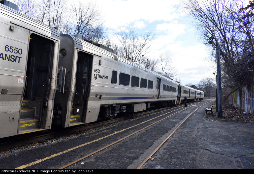 Conductor of NJT Train # 1710 checking for passengers at Kingsland Station before departure 